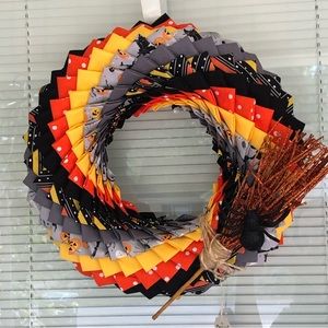 Handmade Halloween wreath with broomstick detail